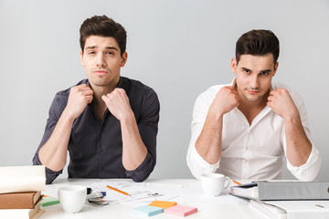 Handsome two serious young business men