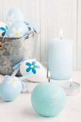 White blue easter eggs, candles