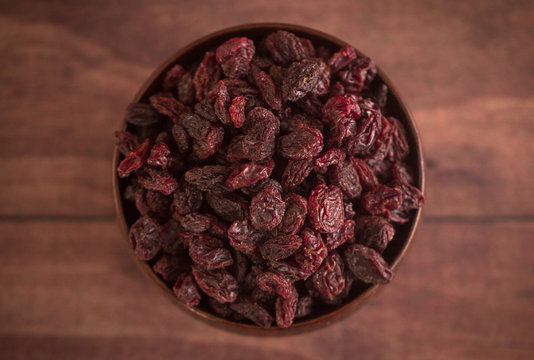 Dried Cranberries In A Wooden Bowl