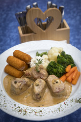 medallions of pork in sauce of cream and pepper with potato roesti, carrots,broccoli, beans and cauliflower