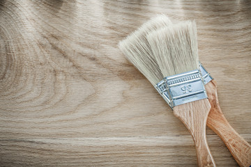 Set of paint brushes on wood board directly above