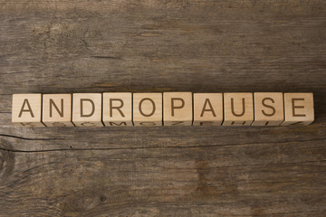 word ANDROPAUSE written on wooden cubes