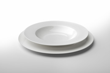 Empty round white plate and bowl