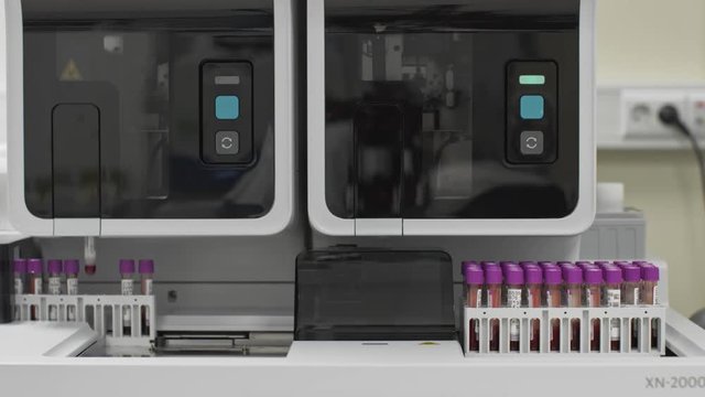 Medical automated blood test robotic machine. Clinical diagnostic laboratory equipment. Blood samples testing to find a treatment. Overall view