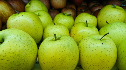 Tasty fresh green apples at grocery store.Buy & eat natural vitamin food.Farmer market department in food shop.