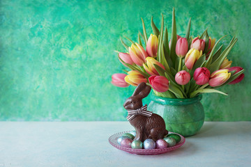 Easter card with chocolate and flowers