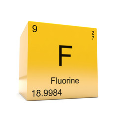 Fluorine chemical element symbol from the periodic table displayed on glossy yellow cube