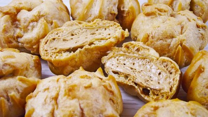 Delicious cakes choux pastry with cream.