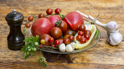 Still life of tomatoes, peppers and spices
