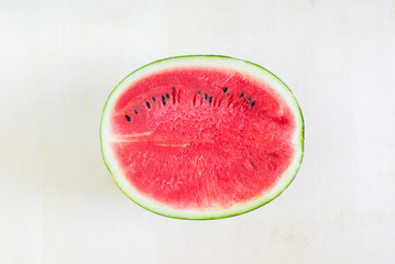 Watermelon cut half on wooden table