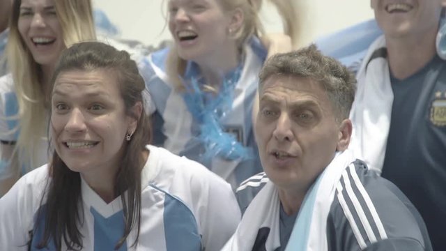 Argentinian football fans cheering at match