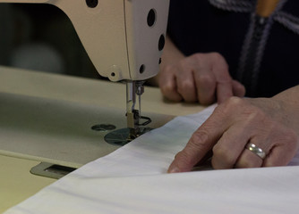  women's hands for sewing machine