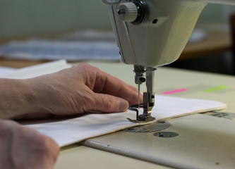  women's hands for sewing machine