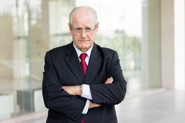Portrait of Unhappy Senior Ceo Near to Office Building