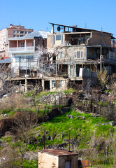 Fototapeta na wymiar Old houses and modern building in spring in Yerevan, Armenia