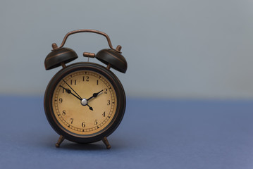 Watch the alarm clock on a blue background.