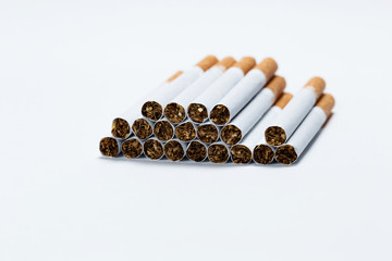 Close-up of cigarettes against white background