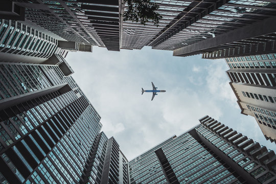 Plane lying over skyscrapers