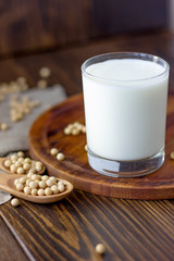 Soy milk with soy beans around it.