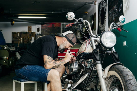 Mechanic repairing the motorcycle