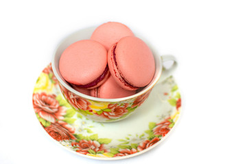 Fototapeta na wymiar Sweet and bright start of the day with macaroons