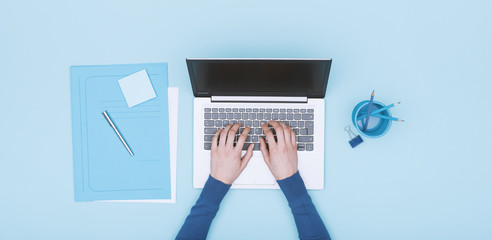 Monochrome workspace with laptop