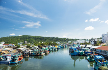 Fototapeta na wymiar Colorful fishing boats in a harbour. Phu Quoc island, Vietnam.