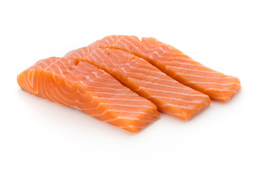 Fresh salmon fillet with basil on the white background.