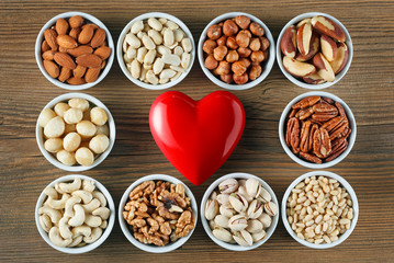 Different types of nuts in small bowls