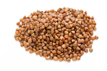 Buckwheat grains isolated on the white background.