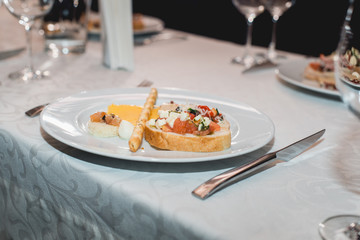 Table served for a wine tasting. Snacks with Pasta, Cheese, Vegetables. Spain tapas recipe food pintxos. Served dish for food and wine tasting