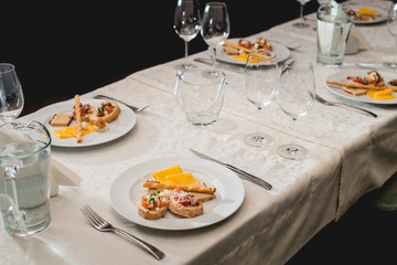 Table served for a wine tasting. Snacks with Pasta, Cheese, Vegetables. Spain tapas recipe food pintxos. Served dish for food and wine tasting