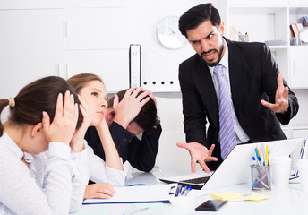 Fototapeta premium Irritated boss scolding subordinates