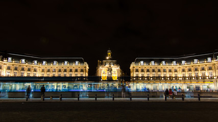 Tram passage in front of the "Place de la Bourse" of Bordeaux city by night	