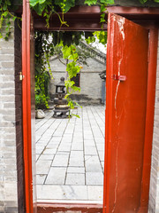 Back entrance to the Niujie Mosque in Beijing leading to a courtyard with incense burner, China