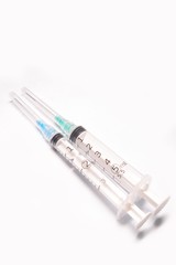 Fototapeta premium Two medical syringe closeup on white background isolated