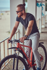 Fototapeta premium A handsome redhead male with a stylish haircut and beard dressed