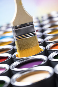 Open paint cans with a brush, Rainbow colors