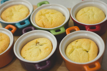 Cottage cheese casserole in colored ceramic forms in the form of