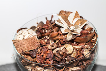 close up of dried leaves in glass bowl