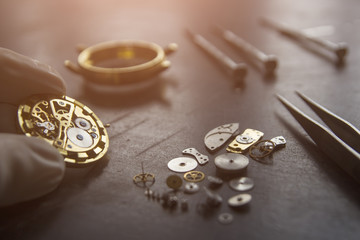 Watchmaker is repairing the mechanical watches in his workshop