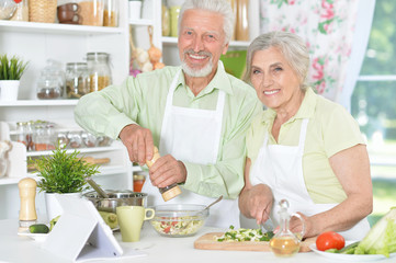 senior couple preparing dinner