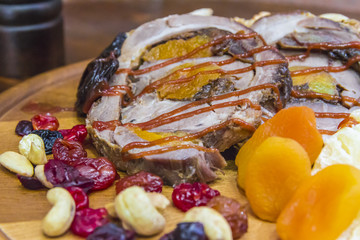 Pork roll stuffed with dried  fruit