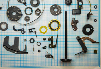 parts old retro film SLR camera on graph paper