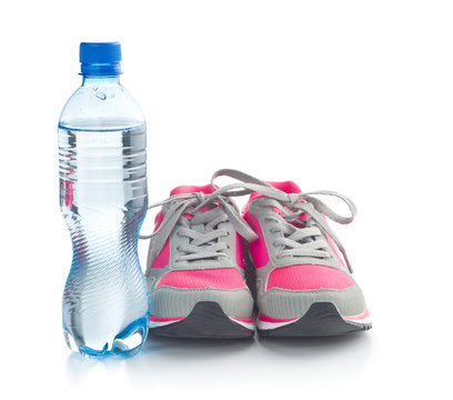 Sports shoes and a bottle of water.