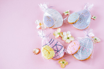 Obraz na płótnie Canvas Easter holiday decoration. Egg shaped cookies with frosting