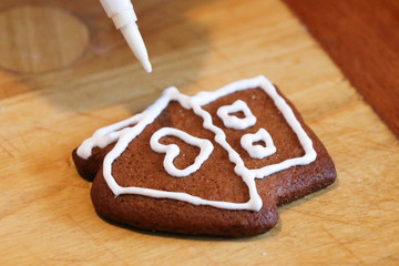 High angle view of cookies being decorated on table 