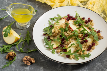 Vitamin vegetarian salad with quinoa, fruits and nuts