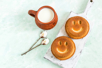 Funny homemade cupcakes in form of smiling face