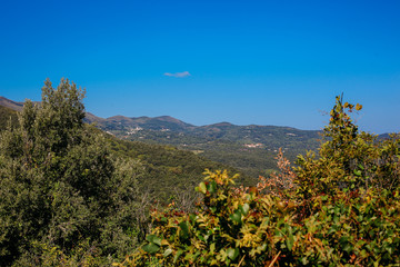 a view of the mountains and the Mediterranean Sea on a sunny summer day. Greece, travel.